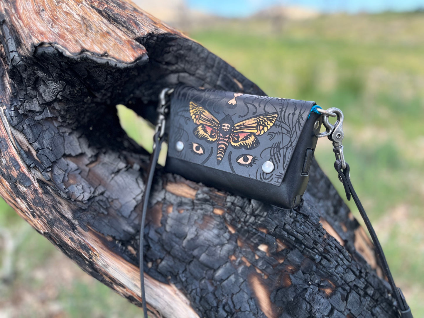 Large crossbody bag you can remove the strap and carry as a clutch or attach to your own belt.