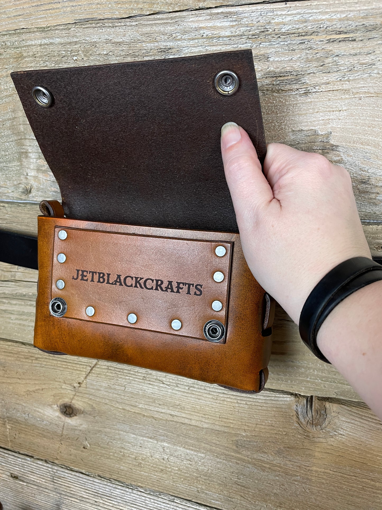 This size includes a easy access pocket for an I.D. , Credit/Debit card, or other cards.